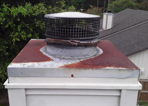 Rusted chase pan before replacement - Jacksonville FL chimney